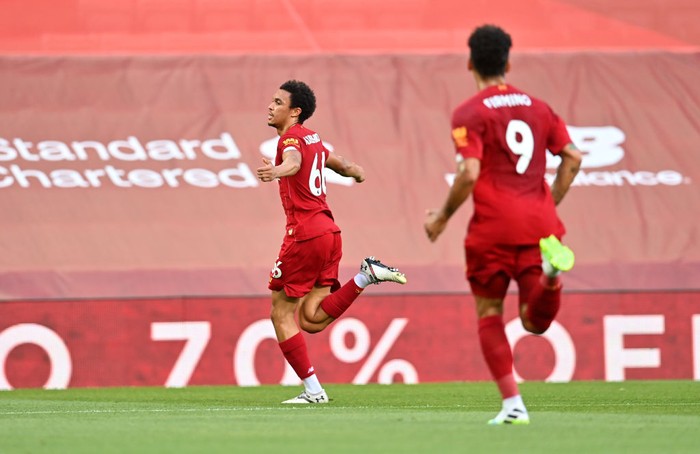LIVERPOOL, ENGLAND - JUNE 24: Trent Alexander-Arnold of Liverpool celebrates after scoring his teams first goal during the Premier League match between Liverpool FC and Crystal Palace at Anfield on June 24, 2020 in Liverpool, England. (Photo by Paul Ellis/Pool via Getty Images)