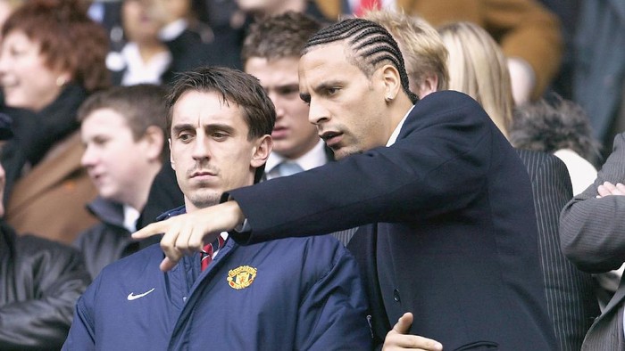 MANCHESTER, ENGLAND - MARCH 14:  Rio Ferdinand and Gary Neville of Manchester United watch from the stands during the FA Barclaycard Premiership match between Manchester City and Manchester United at The City of Manchester Stadium on March 14, 2004 in Manchester, England.  (Photo by Alex Livesey/Getty Images)