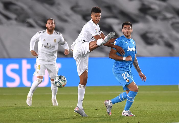 Raphael Varane MADRID, SPAIN - JUNE 18: Raphaël Varane of Real Madrid CF is fouled by Maximiliano Gómez of Valencia CF during the Liga match between Real Madrid CF and Valencia CF at Estadio Alfredo Di Stefano on June 18, 2020 in Madrid, Spain. (Photo by Denis Doyle/Getty Images)