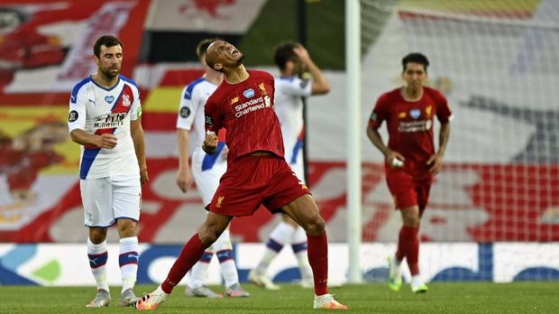 Liverpool's Fabinho scores his side's third goal during the English Premier League soccer match between Liverpool and Crystal Palace at Anfield Stadium in Liverpool, England, Wednesday, June 24, 2020. (Shaun Botterill/Pool via AP)