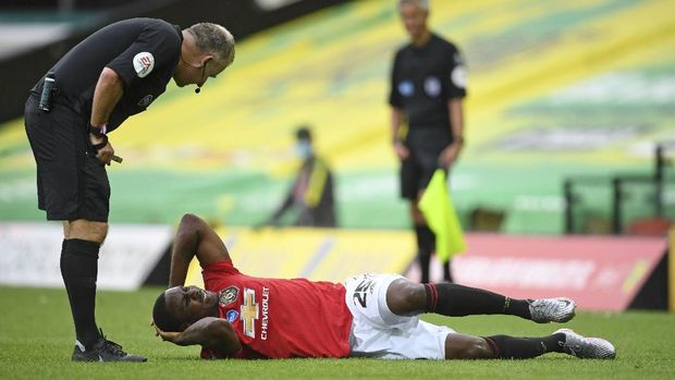Manchester United's Odion Ighalo reacts after a challenge during the FA Cup sixth round soccer match between Norwich City and Manchester United at Carrow Road stadium in Norwich, England, Saturday, June 27, 2020. (Joe Giddens/Pool via AP)