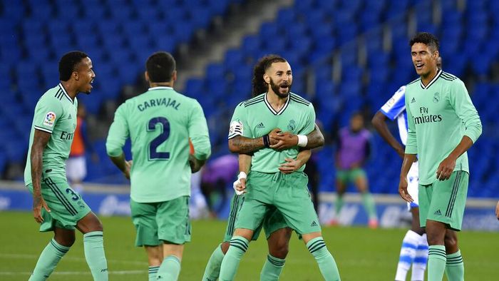 Karim Benzema Real Madrids Karim Benzema celebrates his goal during the Spanish La Liga soccer match between Real Sociedad and Real Madrid at Anoeta stadium, San Sebastian, Spain, Sunday, June 21, 2020. (AP Photo/Alvaro Barrientos)