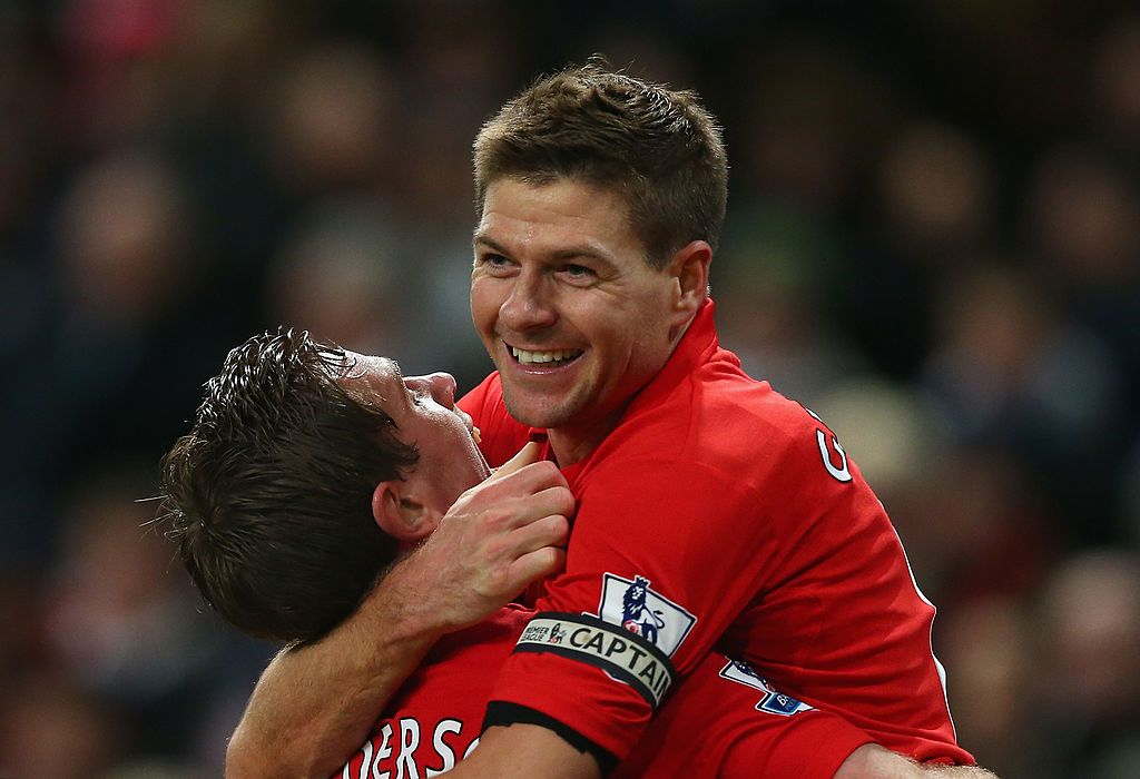 LIVERPOOL, ENGLAND - JANUARY 20:  Steven Gerrard of Liverpool hands the Captain's arm band over to Jordan Henderson of Liverpool during the Capital One Cup Semi-Final first leg match between Liverpool and Chelsea at Anfield on January 20, 2015 in Liverpool, England.  (Photo by Michael Regan/Getty Images)