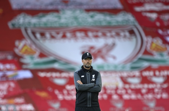 Liverpools manager Jurgen Klopp stands on the pitch before the English Premier League soccer match between Liverpool and Crystal Palace at Anfield Stadium in Liverpool, England, Wednesday, June 24, 2020. (Shaun Botterill/Pool via AP)