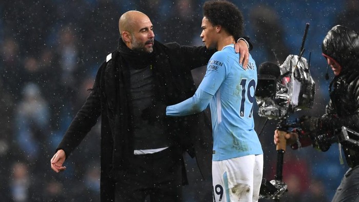 MANCHESTER, ENGLAND - MARCH 04:  Josep Guardiola, Manager of Manchester City and Leroy Sane speak following the Premier League match between Manchester City and Chelsea at Etihad Stadium on March 4, 2018 in Manchester, England.  (Photo by Shaun Botterill/Getty Images)