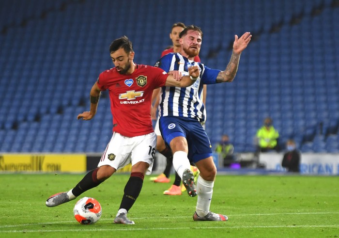 BRIGHTON, ENGLAND - JUNE 30: Bruno Fernandes
of Manchester United scores his sides second goal during the Premier League match between Brighton & Hove Albion and Manchester United at American Express Community Stadium on June 30, 2020 in Brighton, United Kingdom. Football Stadiums around Europe remain empty due to the Coronavirus Pandemic as Government social distancing laws prohibit fans inside venues resulting in games being played behind closed doors. (Photo by Mike Hewitt/Getty Images)