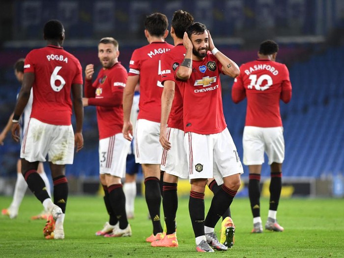 BRIGHTON, ENGLAND - JUNE 30: Bruno Fernandes
of Manchester United celebrates scoring his sides second goal during the Premier League match between Brighton & Hove Albion and Manchester United at American Express Community Stadium on June 30, 2020 in Brighton, United Kingdom. Football Stadiums around Europe remain empty due to the Coronavirus Pandemic as Government social distancing laws prohibit fans inside venues resulting in games being played behind closed doors. (Photo by Andy Rain/Pool via Getty Images)