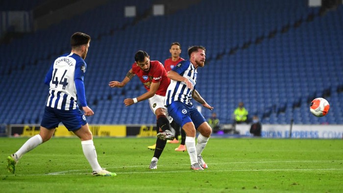 BRIGHTON, ENGLAND - JUNE 30: Bruno Fernandes
of Manchester United scores his sides second goal during the Premier League match between Brighton & Hove Albion and Manchester United at American Express Community Stadium on June 30, 2020 in Brighton, United Kingdom. Football Stadiums around Europe remain empty due to the Coronavirus Pandemic as Government social distancing laws prohibit fans inside venues resulting in games being played behind closed doors. (Photo by Mike Hewitt/Getty Images)