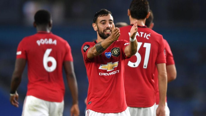 BRIGHTON, ENGLAND - JUNE 30: Bruno Fernandes
of Manchester United scores his sides second goal during the Premier League match between Brighton & Hove Albion and Manchester United at American Express Community Stadium on June 30, 2020 in Brighton, United Kingdom. Football Stadiums around Europe remain empty due to the Coronavirus Pandemic as Government social distancing laws prohibit fans inside venues resulting in games being played behind closed doors. (Photo by Mike Hewitt/Getty Images)
