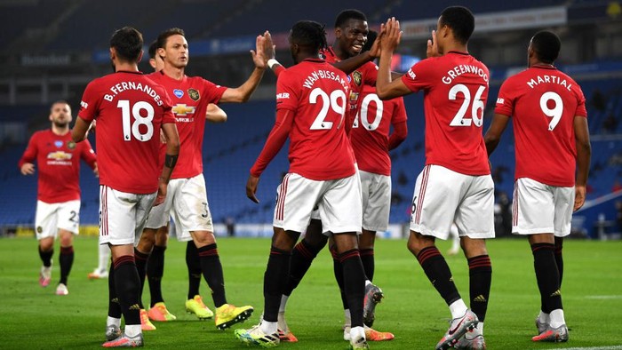 BRIGHTON, ENGLAND - JUNE 30: Paul Pogba of Manchester United 
 congratulates Mason Greenwood on scoring the opening goal during the Premier League match between Brighton & Hove Albion and Manchester United at American Express Community Stadium on June 30, 2020 in Brighton, United Kingdom. (Photo by Mike Hewitt/Getty Images)