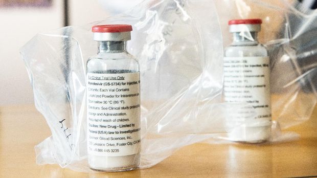 Vials of the drug Remdesivir lie during a press conference about the start of a study with the Ebola drug Remdesivir in particularly severely ill patients at the University Hospital Eppendorf (UKE) in Hamburg, northern Germany on April 8, 2020, amidst the new coronavirus COVID-19 pandemic. (Photo by Ulrich Perrey / POOL / AFP)