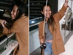 Santuy! Ngidam Makan Ikan, Wanita Ini Pancing Ikan dari Balkon Rumahnya
