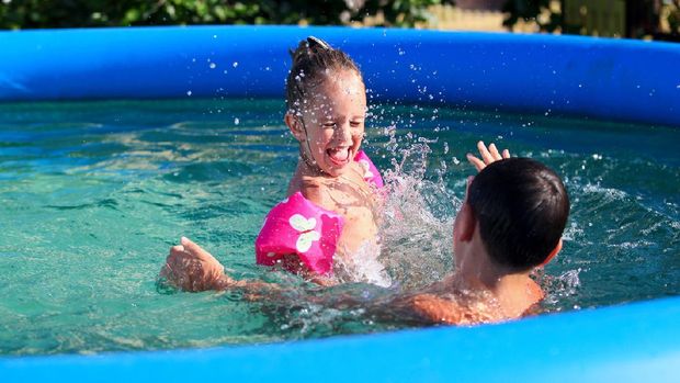 Kids having fun in the swimming pool