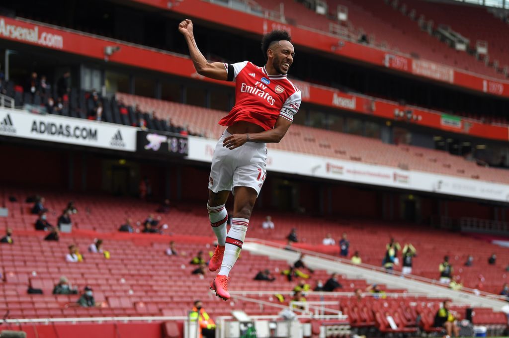 LONDON, ENGLAND - JULY 01: Pierre-Emerick Aubameyang of Arsenal celebrates after scoring his team's first goal during the Premier League match between Arsenal FC and Norwich City at Emirates Stadium on July 01, 2020 in London, England. Football Stadiums around Europe remain empty due to the Coronavirus Pandemic as Government social distancing laws prohibit fans inside venues resulting in all fixtures being played behind closed doors. (Photo by Shaun Botterill/Getty Images)