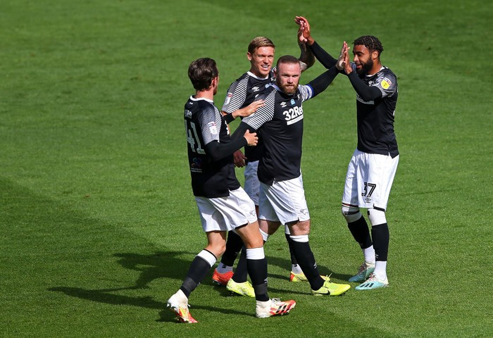 PRESTON, ENGLAND - JULY 01:  Wayne Rooney of Derby County celebrates with team mates after scoring the opening goal during the Sky Bet Championship match between Preston North End and Derby County at Deepdale on July 01, 2020 in Preston, England. (Photo by Alex Livesey/Getty Images)