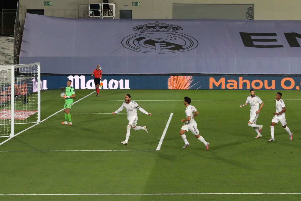 MADRID, SPAIN - JULY 02: Sergio Ramos of Real Madrid celebrates his team's first goal with teammates during the Liga match between Real Madrid CF and Getafe CF at Estadio Alfredo Di Stefano on July 02, 2020 in Madrid, Spain. Football Stadiums around Europe remain empty due to the Coronavirus Pandemic as Government social distancing laws prohibit fans inside venues resulting in all fixtures being played behind closed doors. (Photo by Angel Martinez/Getty Images)