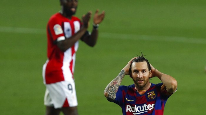 Barcelonas Lionel Messi gestures during the Spanish La Liga soccer match between FC Barcelona and Athletic Bilbao at the Camp Nou stadium in Barcelona, Spain, Tuesday, June 23, 2020. (AP Photo/Joan Monfort)