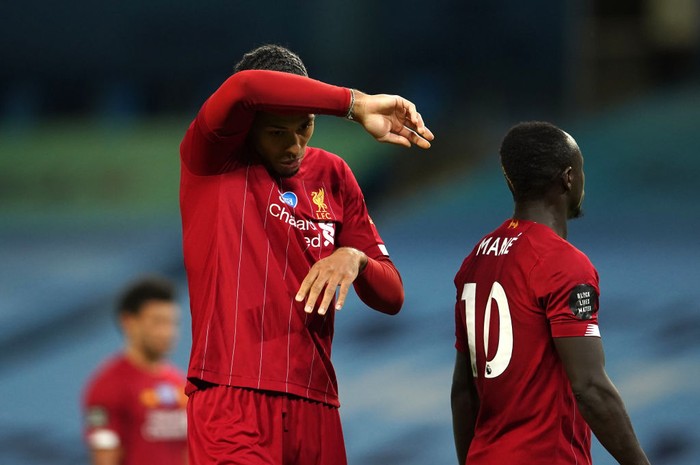 MANCHESTER, ENGLAND - JULY 02: Virgil van Dijk of Liverpool reacts during the Premier League match between Manchester City and Liverpool FC at Etihad Stadium on July 02, 2020 in Manchester, England. Football Stadiums around Europe remain empty due to the Coronavirus Pandemic as Government social distancing laws prohibit fans inside venues resulting in all fixtures being played behind closed doors. (Photo by Dave Thompson/Pool via Getty Images)