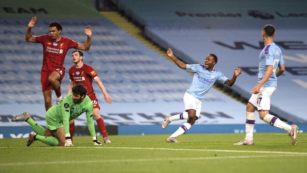 Manchester City's Raheem Sterling, second right, celebrates after his team's fourth goal during the English Premier League soccer match between Manchester City and Liverpool at Etihad Stadium in Manchester, England, Thursday, July 2, 2020. (AP Photo/Laurence Griffiths,Pool)
