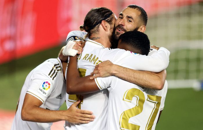 Real Madrid MADRID, SPAIN - JULY 02: Sergio Ramos of Real Madrid celebrates his teams first goal with teammates during the Liga match between Real Madrid CF and Getafe CF at Estadio Alfredo Di Stefano on July 02, 2020 in Madrid, Spain. Football Stadiums around Europe remain empty due to the Coronavirus Pandemic as Government social distancing laws prohibit fans inside venues resulting in all fixtures being played behind closed doors. (Photo by Angel Martinez/Getty Images)