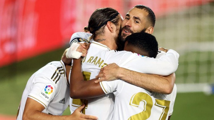 MADRID, SPAIN - JULY 02: Sergio Ramos of Real Madrid celebrates his teams first goal with teammates during the Liga match between Real Madrid CF and Getafe CF at Estadio Alfredo Di Stefano on July 02, 2020 in Madrid, Spain. Football Stadiums around Europe remain empty due to the Coronavirus Pandemic as Government social distancing laws prohibit fans inside venues resulting in all fixtures being played behind closed doors. (Photo by Angel Martinez/Getty Images)