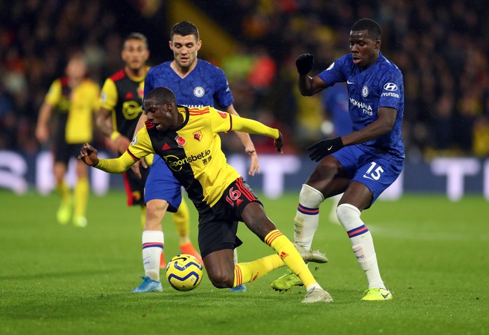 WATFORD, ENGLAND - NOVEMBER 02: Abdoulaye Doucoure of Watford is tackled by Kurt Zouma of Chelsea during the Premier League match between Watford FC and Chelsea FC at Vicarage Road on November 02, 2019 in Watford, United Kingdom. (Photo by Catherine Ivill/Getty Images)