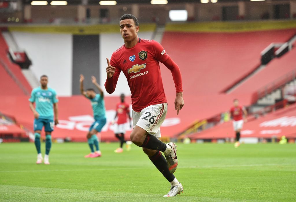 MANCHESTER, ENGLAND - JULY 04: Mason Greenwood of Manchester United celebrates after scoring his team's fourth goal during the Premier League match between Manchester United and AFC Bournemouth  at Old Trafford on July 04, 2020 in Manchester, England. Football Stadiums around Europe remain empty due to the Coronavirus Pandemic as Government social distancing laws prohibit fans inside venues resulting in all fixtures being played behind closed doors. (Photo by Peter Powell/Pool via Getty Images)