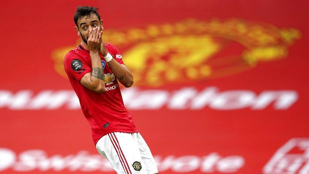 Manchester United's Bruno Fernandes reacts after a play during the English Premier League soccer match between Manchester United and Bournemouth at Old Trafford stadium in Manchester, England, Saturday, July 4, 2020. (AP Photo/Dave Thompson, Pool)