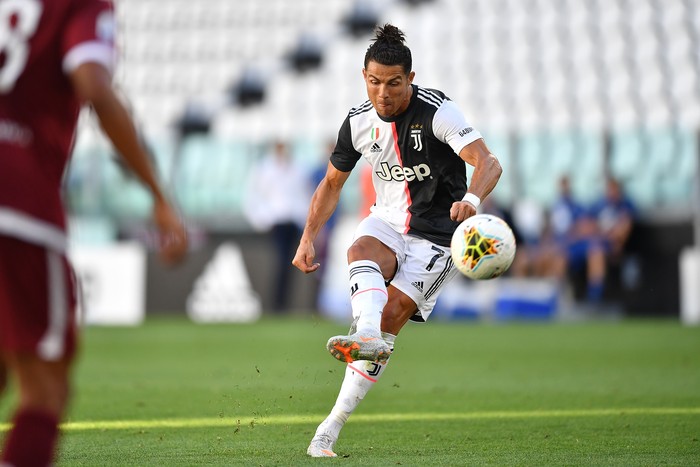 TURIN, ITALY - JULY 04:  Cristiano Ronaldo of Juventus scores a goal during the Serie A match between Juventus and Torino FC at Allianz Stadium on July 4, 2020 in Turin, Italy.  (Photo by Valerio Pennicino/Getty Images )