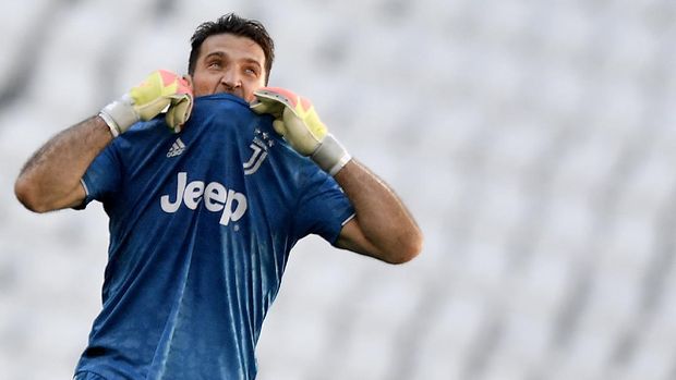 Juventus goalie Gianluigi Buffon reacts during the Serie A soccer match between Juventus and Torino, at the Allianz Stadium in Turin, Italy, Saturday, July 4, 2020. Juventus goalkeeper Gianluigi Buffon set an outright Serie A record on Saturday with his 648th appearance in Italy’s top flight. The Turin derby game against Torino moved the 42-year-old Buffon one ahead of AC Milan great Paolo Maldini, who set the record in 2009. (Fabio Ferrari/LaPresse via AP)