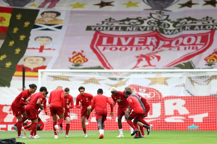 LIVERPOOL, ENGLAND - JULY 05: General view inside the stadium where Liverpool banners are seen in the stands as Liverpool players warm up prior to the Premier League match between Liverpool FC and Aston Villa at Anfield on July 05, 2020 in Liverpool, England.Football Stadiums around Europe remain empty due to the Coronavirus Pandemic as Government social distancing laws prohibit fans inside venues resulting in games being played behind closed doors. (Photo by Carl Recine/Pool via Getty Images)