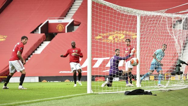 Bournemouth's Junior Stanislas, right, watches the net after scoring a goal during the English Premier League soccer match between Manchester United and Bournemouth at Old Trafford stadium in Manchester, England, Saturday, July 4, 2020. (Peter Powell/Pool via AP)