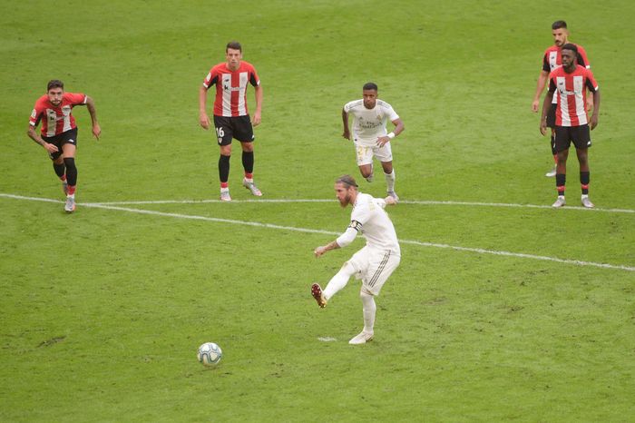 Sergio Ramos BILBAO, SPAIN - JULY 05: Sergio Ramos of Real Madrid scores a penalty for his teams first goal during the La Liga match between Athletic Club and Real Madrid CF at San Mames Stadium on July 05, 2020 in Bilbao, Spain. Football Stadiums around Europe remain empty due to the Coronavirus Pandemic as Government social distancing laws prohibit fans inside venues resulting in all fixtures being played behind closed doors. (Photo by Juan Manuel Serrano Arce/Getty Images)