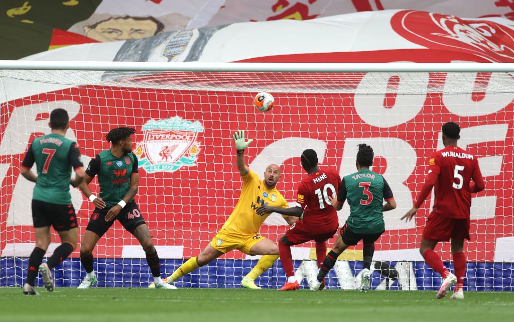 LIVERPOOL, ENGLAND - JULY 05: Sadio Mane of Liverpool scores his team's first goal past Pepe Reina of Aston Villa during the Premier League match between Liverpool FC and Aston Villa at Anfield on July 05, 2020 in Liverpool, England.Football Stadiums around Europe remain empty due to the Coronavirus Pandemic as Government social distancing laws prohibit fans inside venues resulting in games being played behind closed doors. (Photo by Carl Recine/Pool via Getty Images)