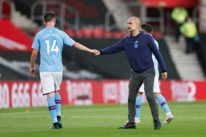SOUTHAMPTON, ENGLAND - JULY 05: Aymeric Laporte of Manchester City shakes hands with Pep Guardiola, Manager of Manchester City following the Premier League match between Southampton FC and Manchester City at St Marys Stadium on July 05, 2020 in Southampton, England. Football Stadiums around Europe remain empty due to the Coronavirus Pandemic as Government social distancing laws prohibit fans inside venues resulting in games being played behind closed doors. (Photo by Frank Augstein/Pool via Getty Images)