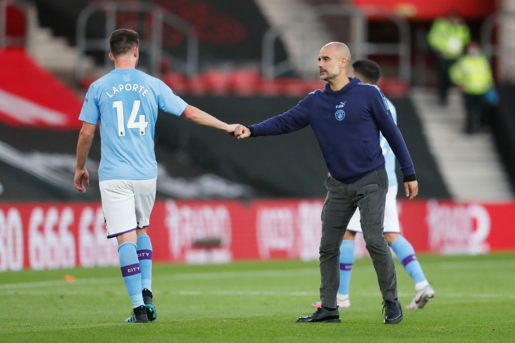 SOUTHAMPTON, ENGLAND - JULY 05: Aymeric Laporte of Manchester City shakes hands with Pep Guardiola, Manager of Manchester City following the Premier League match between Southampton FC and Manchester City at St Mary's Stadium on July 05, 2020 in Southampton, England. Football Stadiums around Europe remain empty due to the Coronavirus Pandemic as Government social distancing laws prohibit fans inside venues resulting in games being played behind closed doors. (Photo by Frank Augstein/Pool via Getty Images)