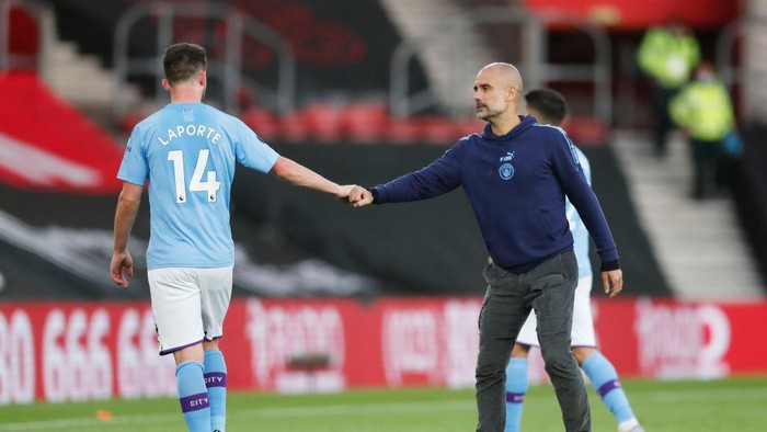 SOUTHAMPTON, ENGLAND - JULY 05: Aymeric Laporte of Manchester City shakes hands with Pep Guardiola, Manager of Manchester City following the Premier League match between Southampton FC and Manchester City at St Marys Stadium on July 05, 2020 in Southampton, England. Football Stadiums around Europe remain empty due to the Coronavirus Pandemic as Government social distancing laws prohibit fans inside venues resulting in games being played behind closed doors. (Photo by Frank Augstein/Pool via Getty Images)
