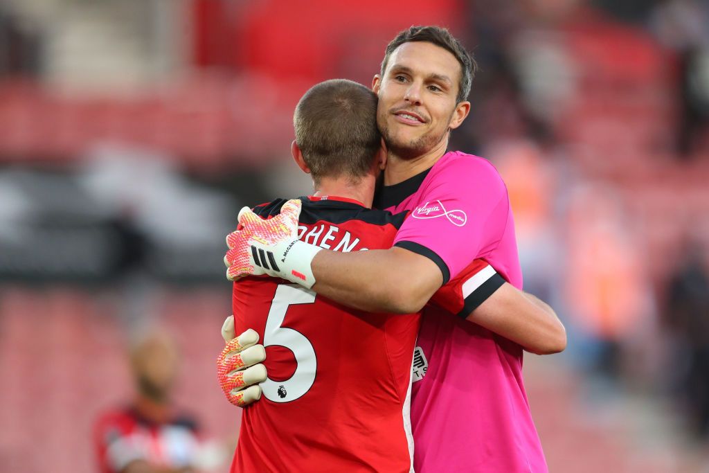 SOUTHAMPTON, ENGLAND - JULY 05: Alex McCarthy of Southampton saves from David Silva of Manchester City during the Premier League match between Southampton FC and Manchester City at St Mary's Stadium on July 05, 2020 in Southampton, England. Football Stadiums around Europe remain empty due to the Coronavirus Pandemic as Government social distancing laws prohibit fans inside venues resulting in games being played behind closed doors. (Photo by Frank Augstein/Pool via Getty Images)