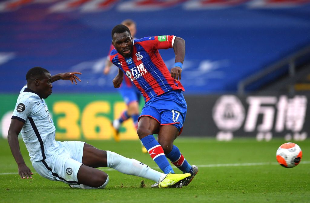 LONDON, ENGLAND - JULY 07: Kurt Zouma of Chelsea and Christian Benteke of Crystal Palace battle for the ball during the Premier League match between Crystal Palace and Chelsea FC at Selhurst Park on July 07, 2020 in London, England. Football Stadiums around Europe remain empty due to the Coronavirus Pandemic as Government social distancing laws prohibit fans inside venues resulting in all fixtures being played behind closed doors. (Photo by Justin Setterfield/Getty Images)