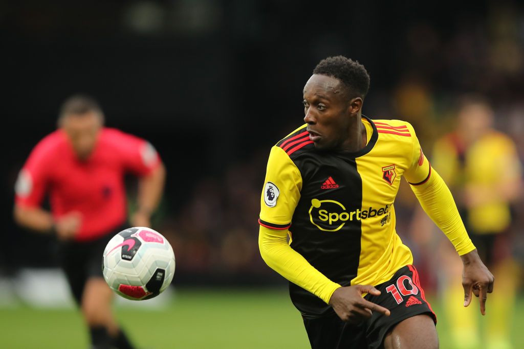 WATFORD, ENGLAND - JULY 07: Danny Welbeck of Watford scores his team's second goal during the Premier League match between Watford FC and Norwich City at Vicarage Road on July 07, 2020 in Watford, England. Football Stadiums around Europe remain empty due to the Coronavirus Pandemic as Government social distancing laws prohibit fans inside venues resulting in all fixtures being played behind closed doors. (Photo by Matt Dunham/Pool via Getty Images)