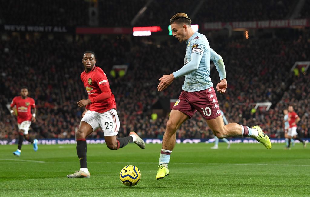 MANCHESTER, ENGLAND - DECEMBER 01: Jack Grealish of Aston Villa controls the ball as Aaron Wan-Bissaka of Manchester United looks on during the Premier League match between Manchester United and Aston Villa at Old Trafford on December 01, 2019 in Manchester, United Kingdom. (Photo by Stu Forster/Getty Images)