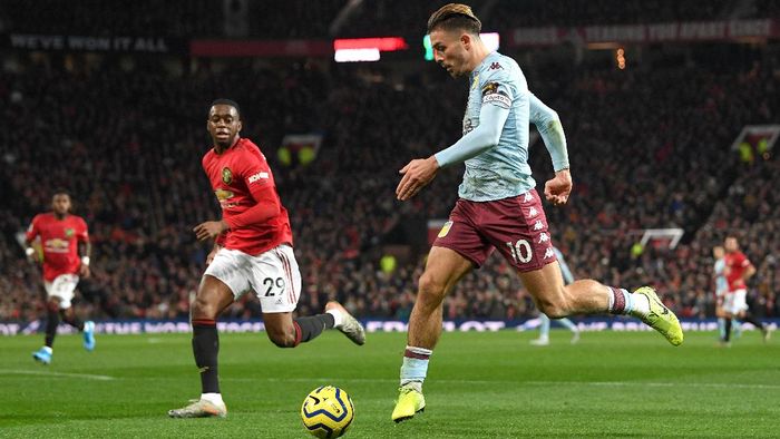 Jack Grealish MANCHESTER, ENGLAND - DECEMBER 01: Jack Grealish of Aston Villa controls the ball as Aaron Wan-Bissaka of Manchester United looks on during the Premier League match between Manchester United and Aston Villa at Old Trafford on December 01, 2019 in Manchester, United Kingdom. (Photo by Stu Forster/Getty Images)