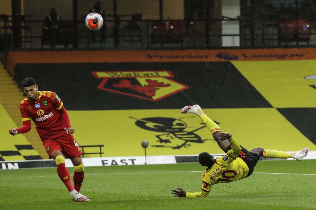 Walford's Danny Welbeck, right, scores his team second goal during the English Premier League soccer match between Watford and Norwich City at the Vicarage Road Stadium in Watford, England, Tuesday, July 7, 2020. (AP Photo/Matt Dunham, Pool)