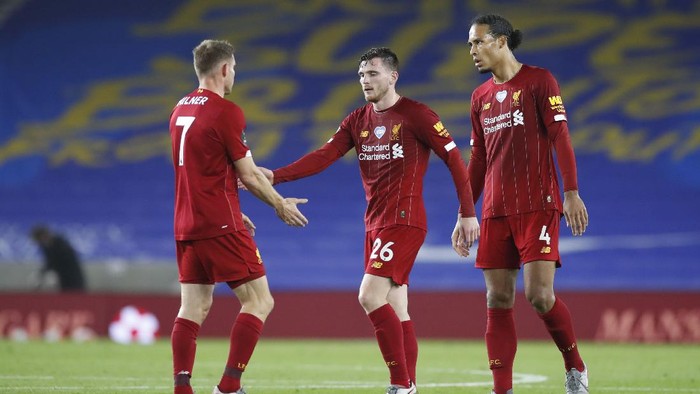 BRIGHTON, ENGLAND - JULY 08: Andy Robertson of Liverpool and Virgil van Dijk of Liverpool interacts with James Milner of Liverpool after the Premier League match between Brighton & Hove Albion and Liverpool FC at American Express Community Stadium on July 08, 2020 in Brighton, England. Football Stadiums around Europe remain empty due to the Coronavirus Pandemic as Government social distancing laws prohibit fans inside venues resulting in all fixtures being played behind closed doors. (Photo by Paul Childs/Pool via Getty Images)