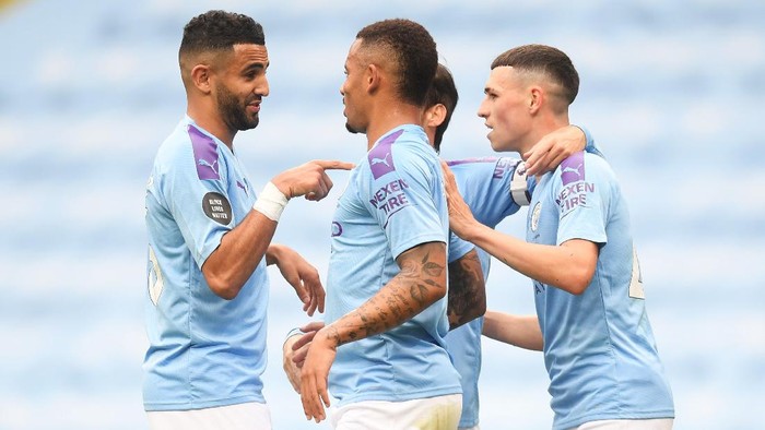 MANCHESTER, ENGLAND - JULY 08: Riyad Mahrez of Manchester City celebrates after he scores his teams second goal during the Premier League match between Manchester City and Newcastle United at Etihad Stadium on July 08, 2020 in Manchester, England. Football Stadiums around Europe remain empty due to the Coronavirus Pandemic as Government social distancing laws prohibit fans inside venues resulting in all fixtures being played behind closed doors. (Photo by Michael Regan/Getty Images)