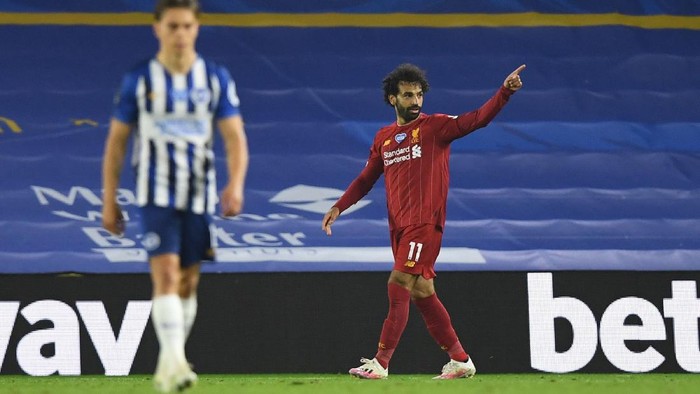 BRIGHTON, ENGLAND - JULY 08: Mohamed Salah of Liverpool celebrates after he scores his sides third goal during the Premier League match between Brighton & Hove Albion and Liverpool FC at American Express Community Stadium on July 08, 2020 in Brighton, England. Football Stadiums around Europe remain empty due to the Coronavirus Pandemic as Government social distancing laws prohibit fans inside venues resulting in all fixtures being played behind closed doors. (Photo by Daniel Leal Olivas/Pool via Getty Images)
