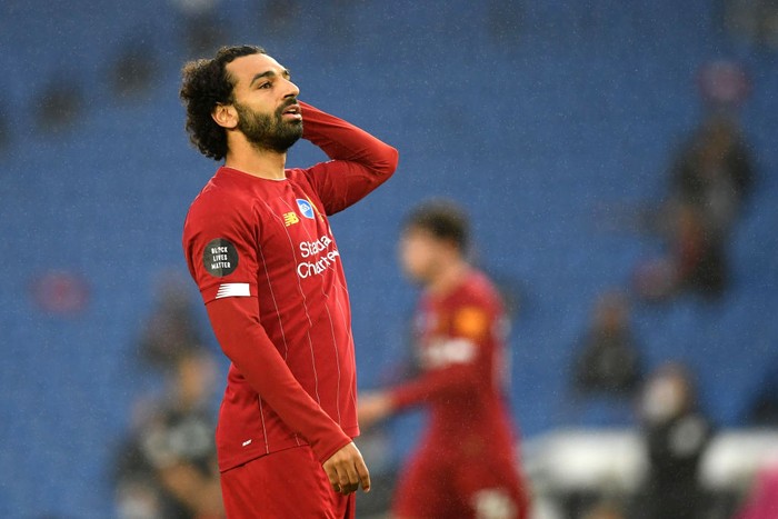 BRIGHTON, ENGLAND - JULY 08: Mohamed Salah of Liverpool reacts during the Premier League match between Brighton & Hove Albion and Liverpool FC at American Express Community Stadium on July 08, 2020 in Brighton, England. Football Stadiums around Europe remain empty due to the Coronavirus Pandemic as Government social distancing laws prohibit fans inside venues resulting in all fixtures being played behind closed doors. (Photo by Daniel Leal Olivas/Pool via Getty Images)