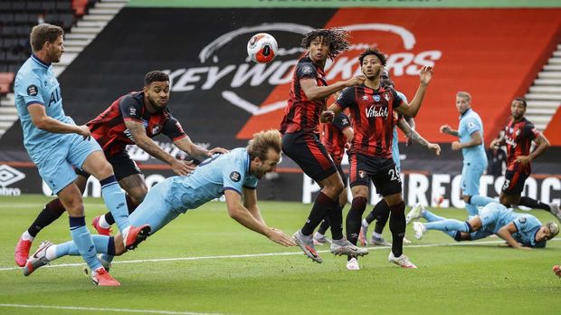 Tottenham's Harry Kane falls during the English Premier League soccer match between Bournemouth and Tottenham at the at Vitality Stadium in Bournemouth, England, Thursday, July 9, 2020. (Richard Heathcote/Pool via AP)