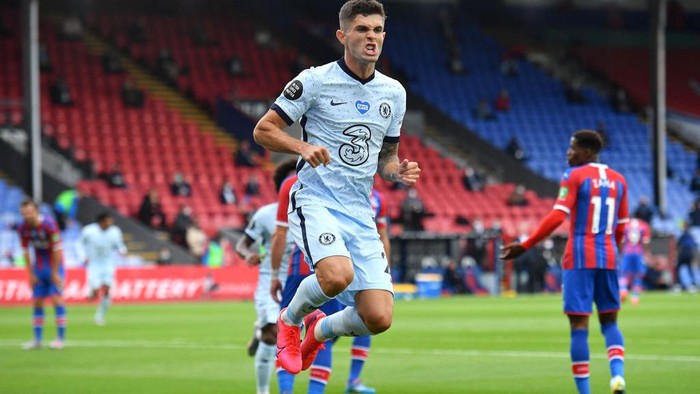 LONDON, ENGLAND - JULY 07: Christian Pulisic of Chelsea celebrates after scoring his teams second goal during the Premier League match between Crystal Palace and Chelsea FC at Selhurst Park on July 07, 2020 in London, England. Football Stadiums around Europe remain empty due to the Coronavirus Pandemic as Government social distancing laws prohibit fans inside venues resulting in all fixtures being played behind closed doors. (Photo by Justin Tallis/Pool via Getty Images)