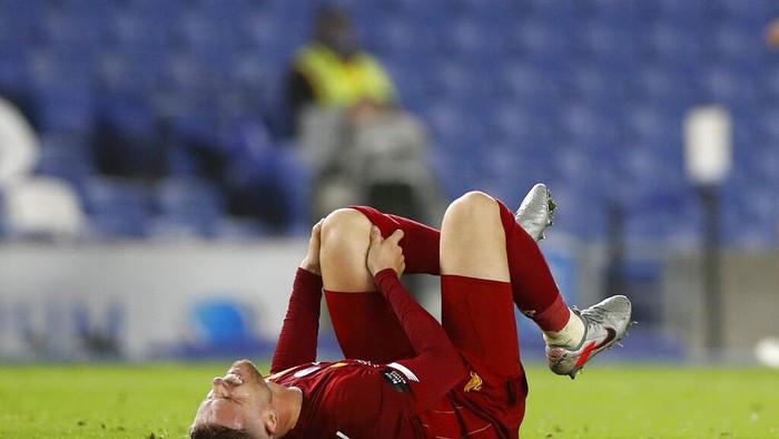 Liverpools Jordan Henderson reacts during the English Premier League soccer match between Brighton and Liverpool at Falmer Stadium in Brighton, England, Wednesday, July 8, 2020. (AP Photo/Paul Childs,Pool)